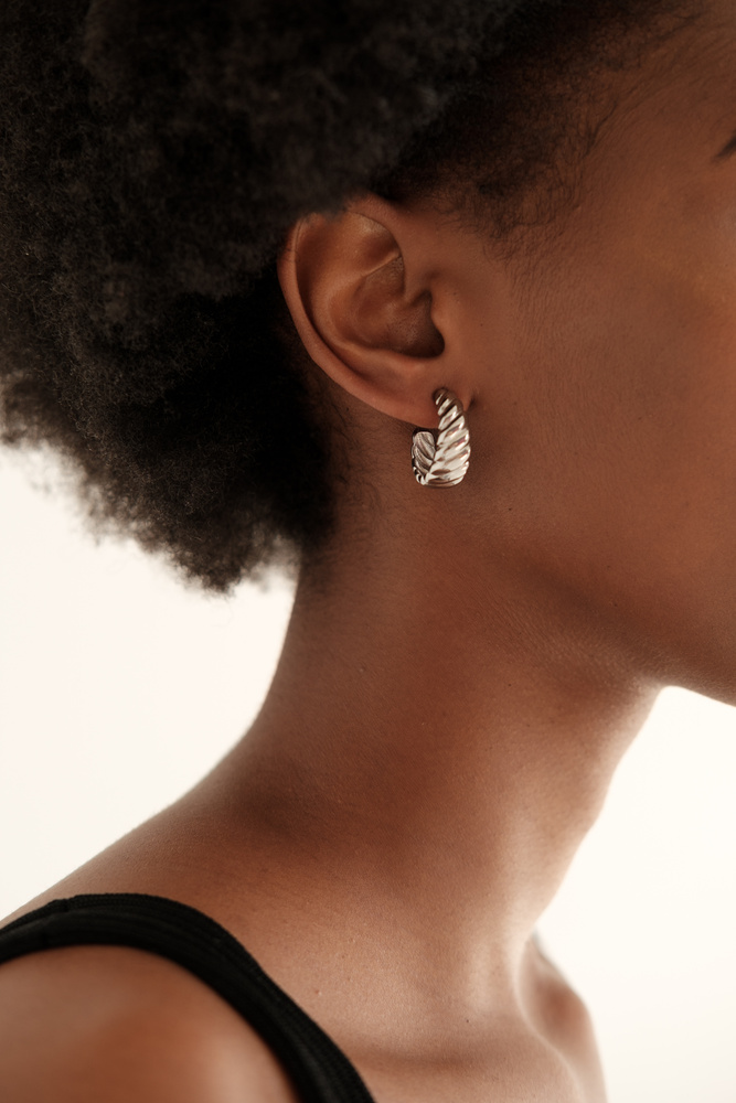 Woman with Minimalist Earrings